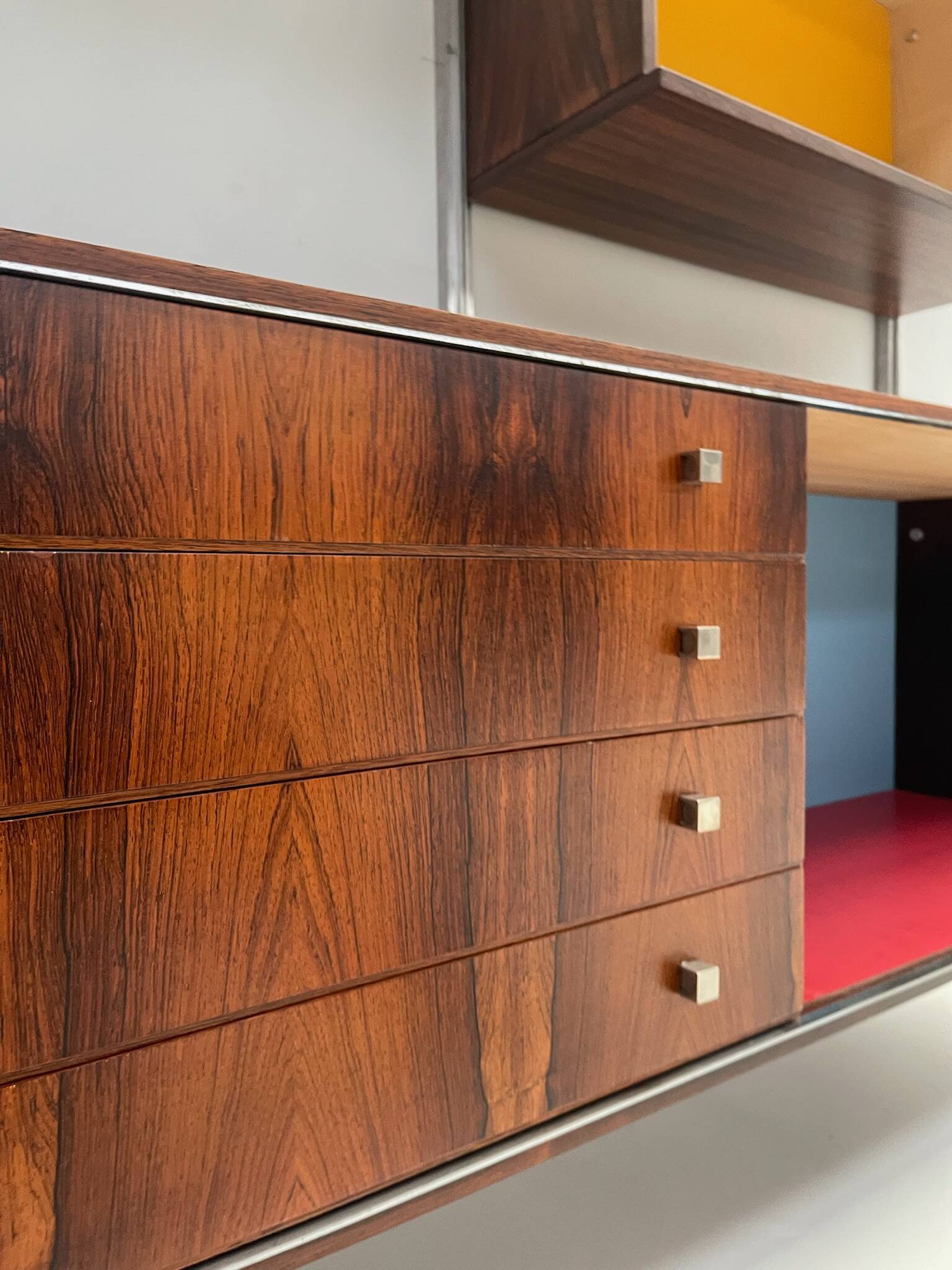 Large colorful wall unit in luxury wood