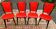 Set of 4 red faux leather chairs