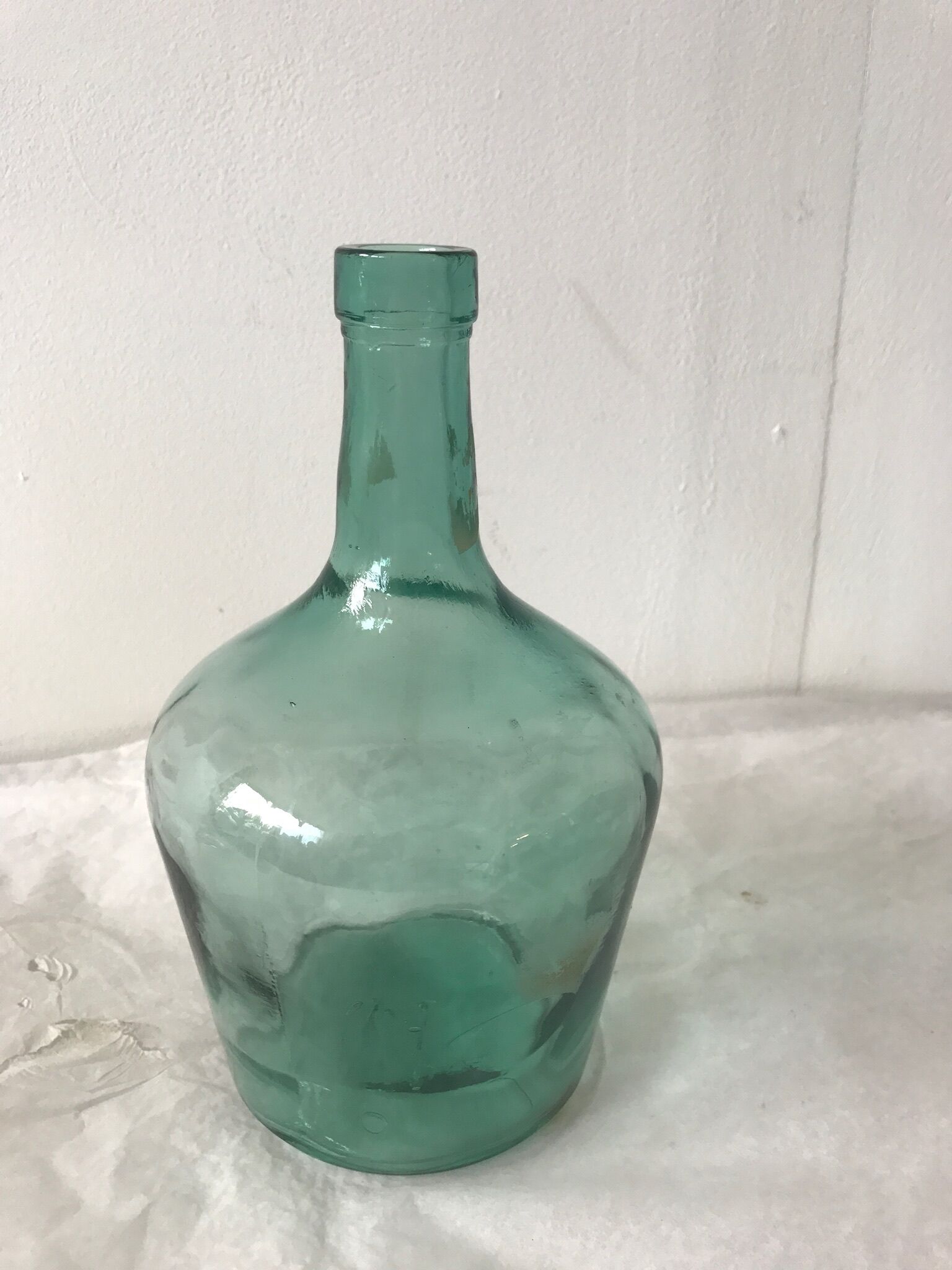 Dame jeanne en verre vert d'eau