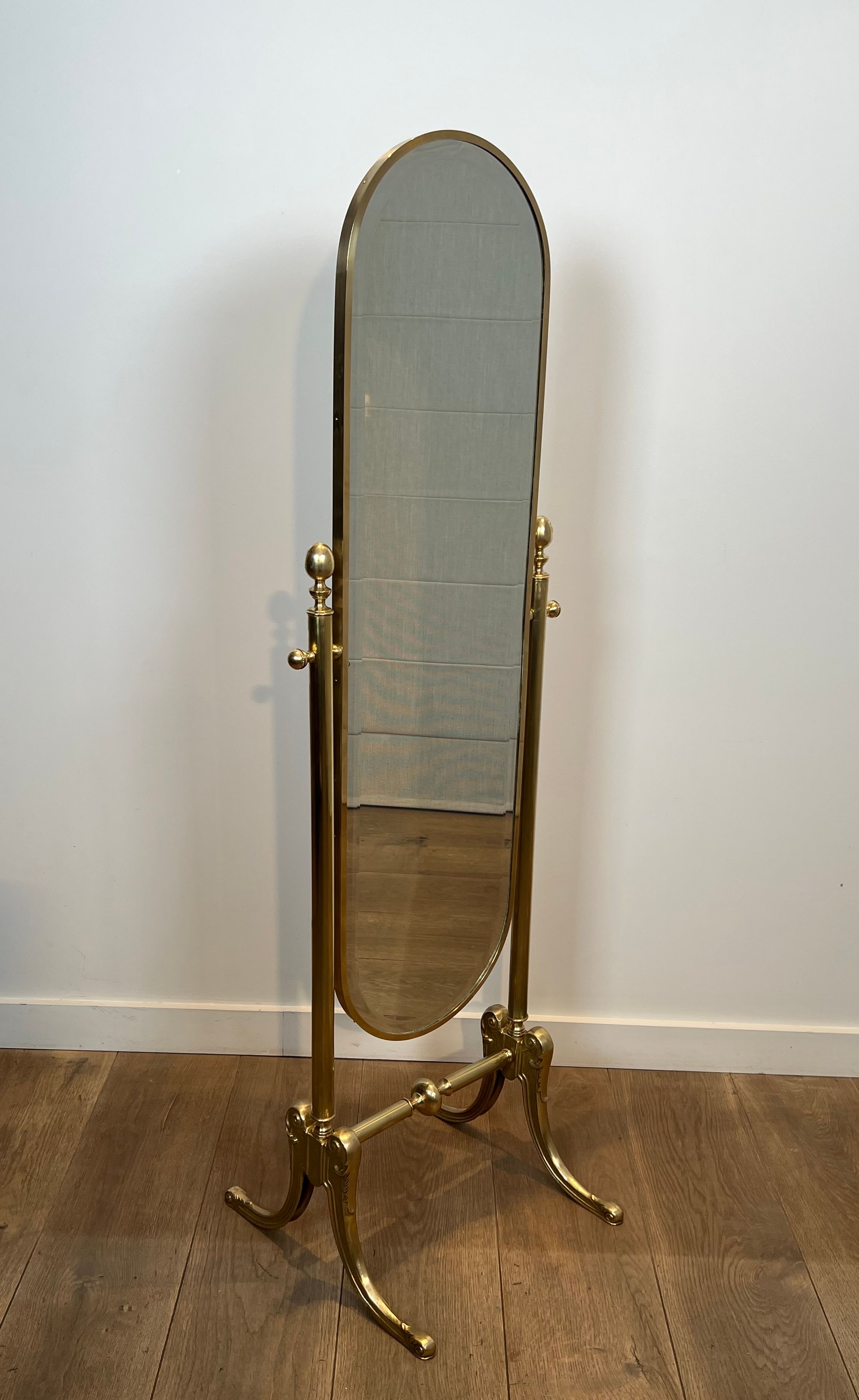 Pair of brass cheval mirrors in neoclassical style