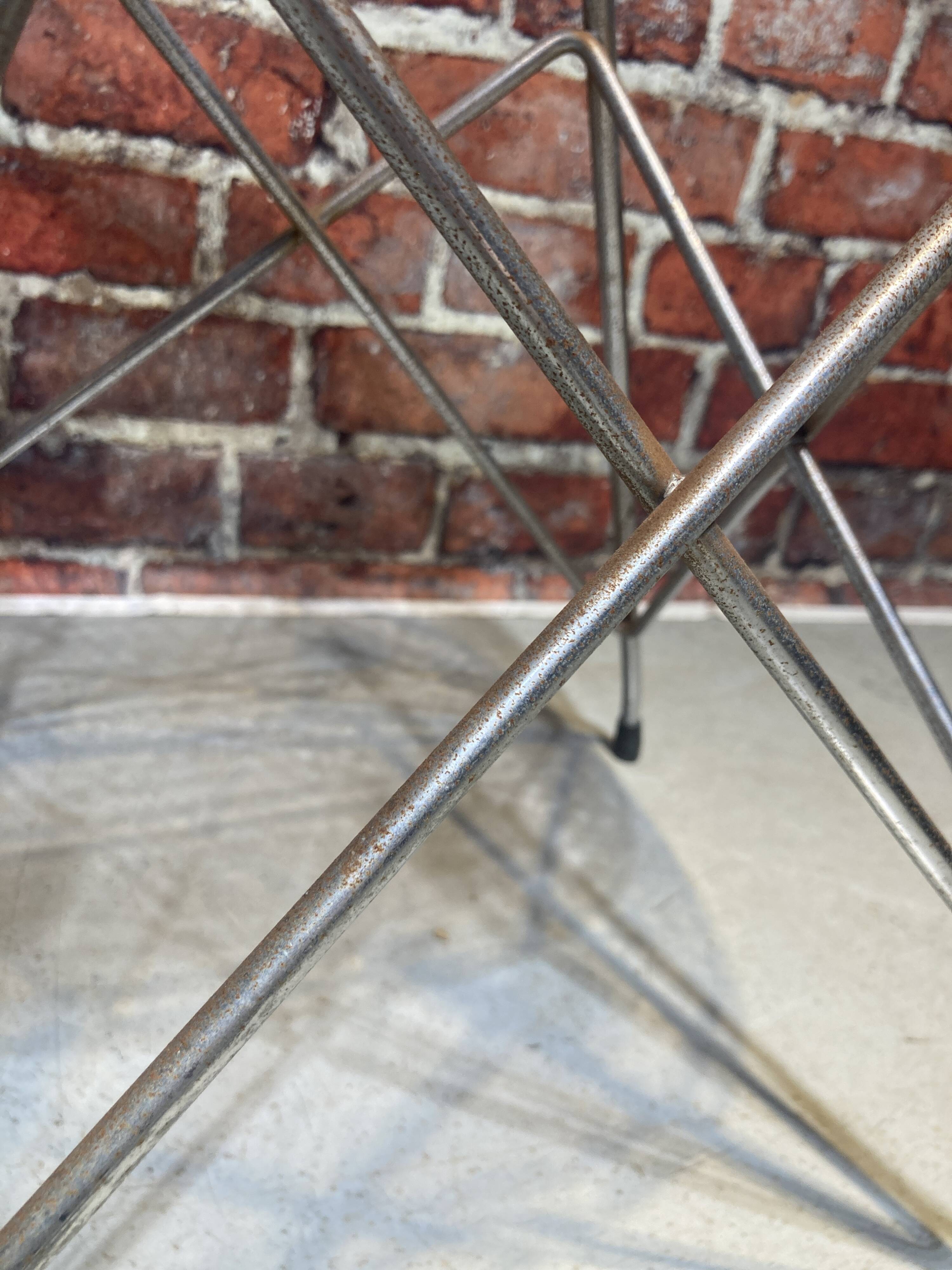 Set of four plexiglass and metal chairs