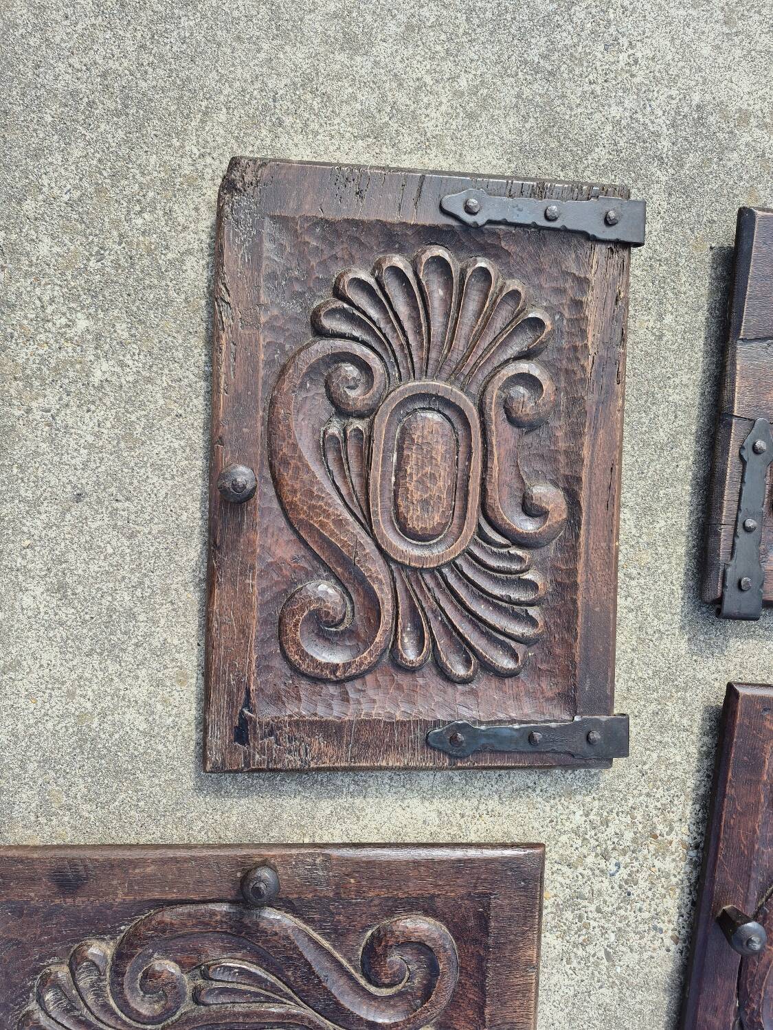 antique cabinet with carvings and wrought iron fittings rural