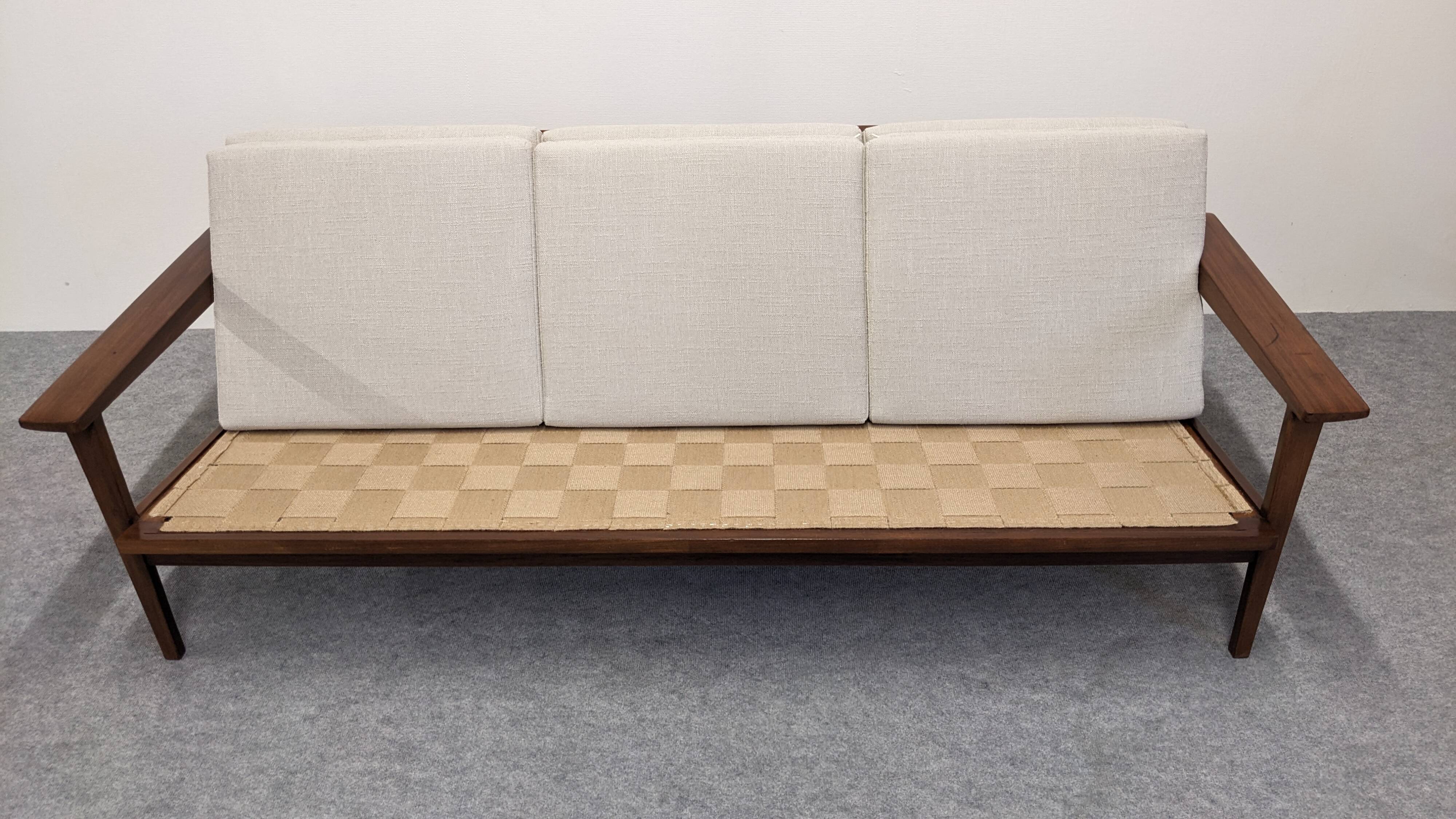 Scandinavian style three-seater sofa in teak, France circa 1950.