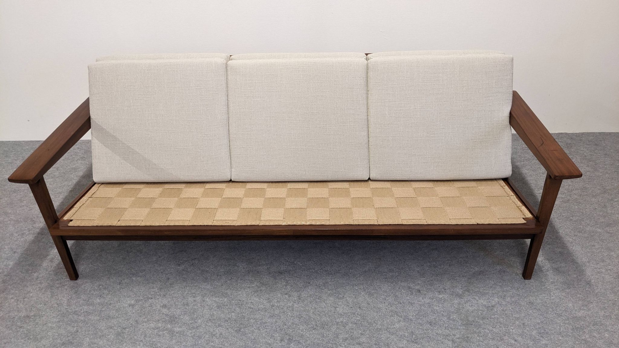 Scandinavian style three-seater sofa in teak, France circa 1950.