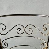 Metal doll's bed on vintage casters