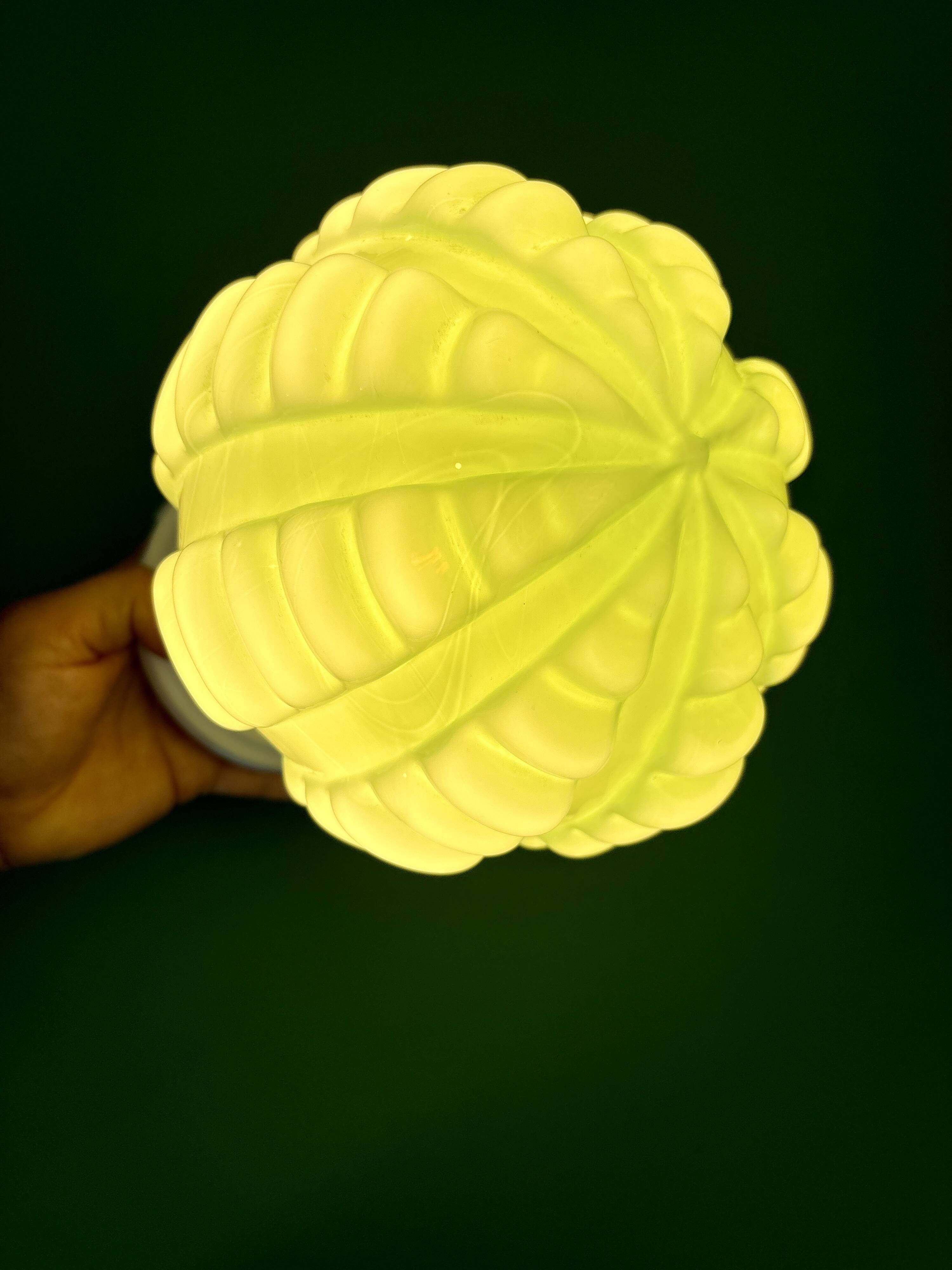 Vintage Art Deco globe wall light in pale green opaline.