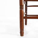 Antique wooden armchair with cane seat, France ca. 1900