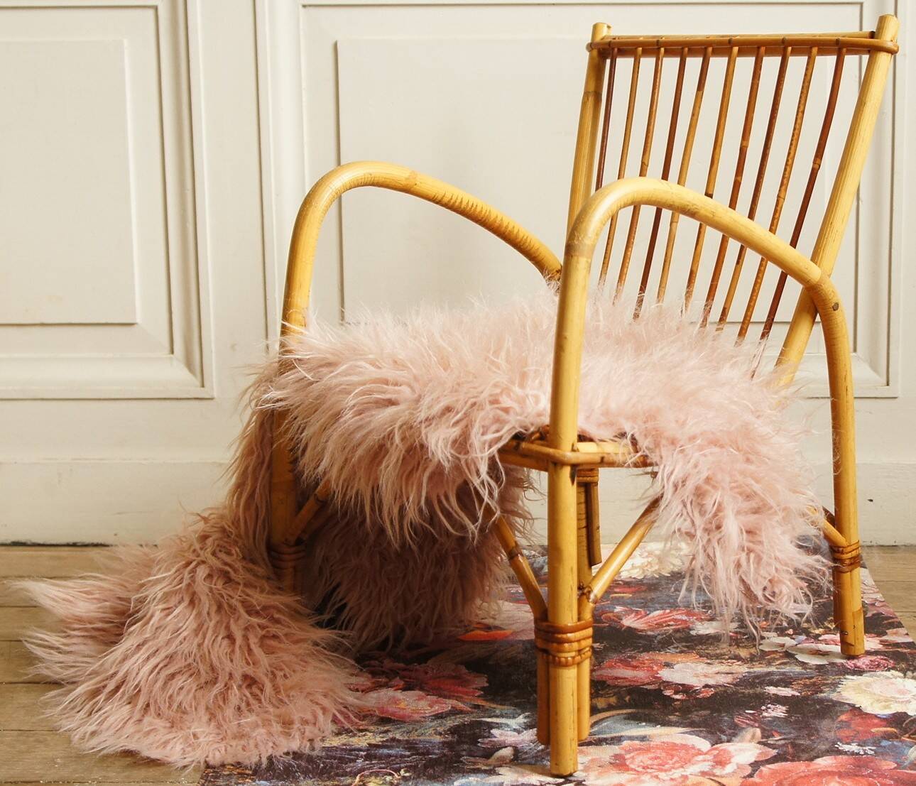 Children's rattan armchair & its old pink skin
