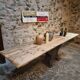 Old French industrial table with a cast iron base and a pine top.