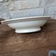 Shallow round plate Boch Frères model Regent with arabesque and foliage decoration.