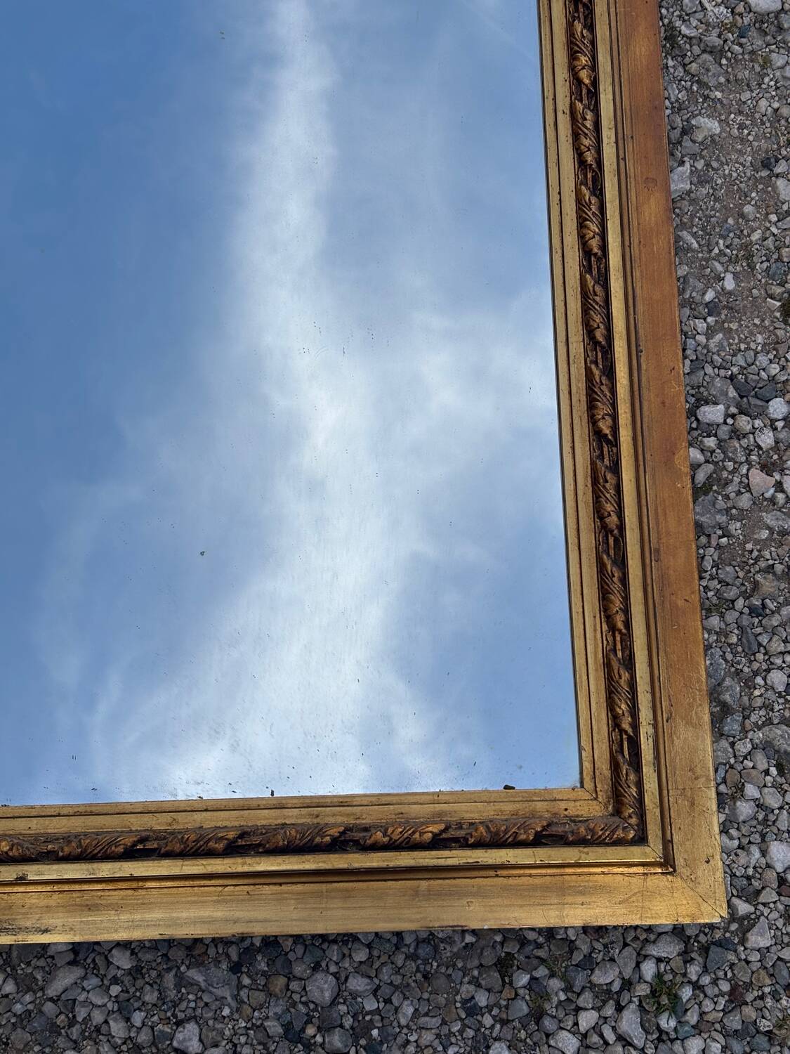 Golden trumeau mirror in Louis XVI style, 20th century.