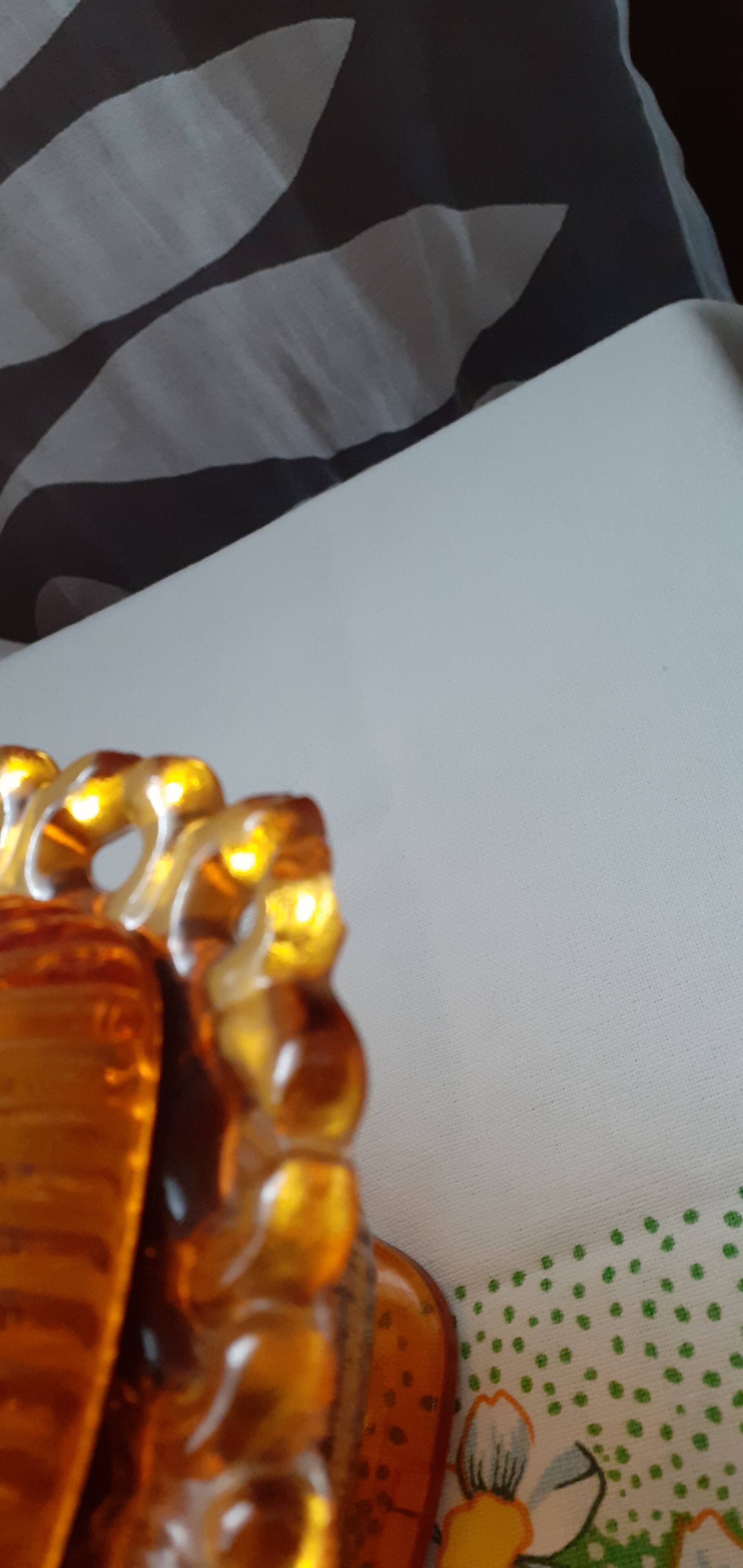 amber-colored pressed glass butter dish