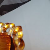 amber-colored pressed glass butter dish