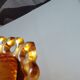 amber-colored pressed glass butter dish