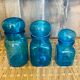 Trio of jars apothecary bottle in blue glass with round cap