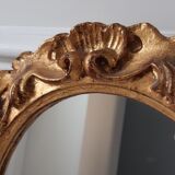 Old mirror in gilded wood late nineteenth