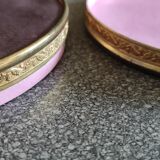 Old round box with decoration fixed under glass