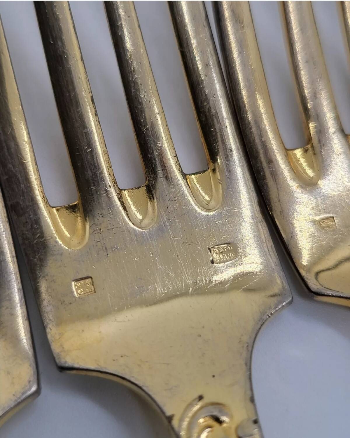 12 Table Forks in gold metal