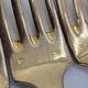 12 Table Forks in gold metal