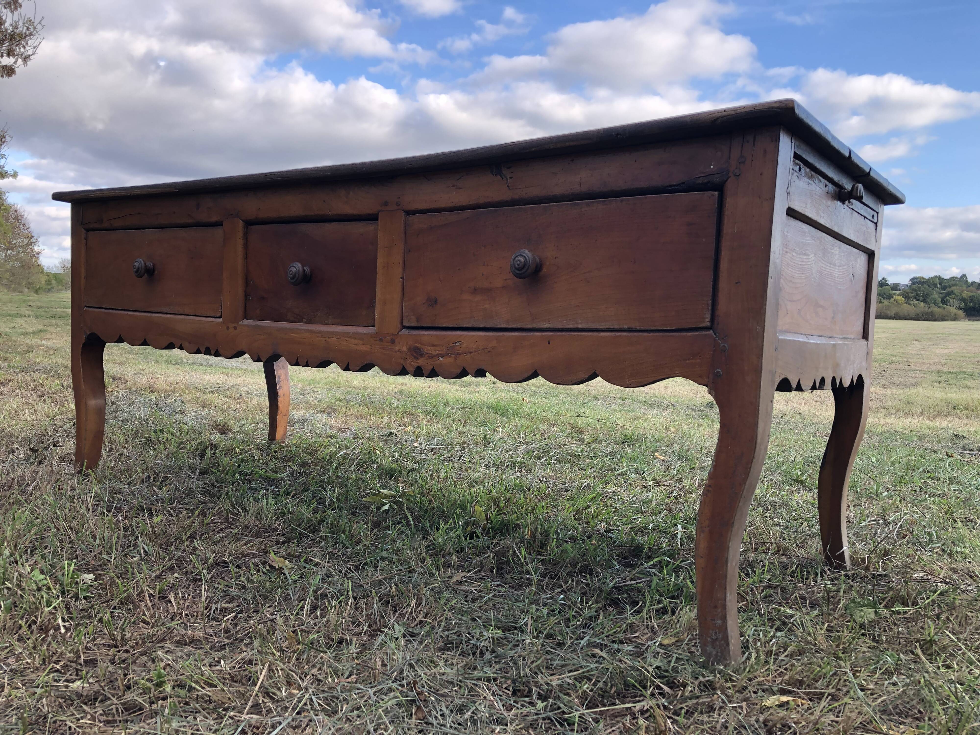 Antique Louis XV paneled table with 3 front drawers in solid cherry wood
