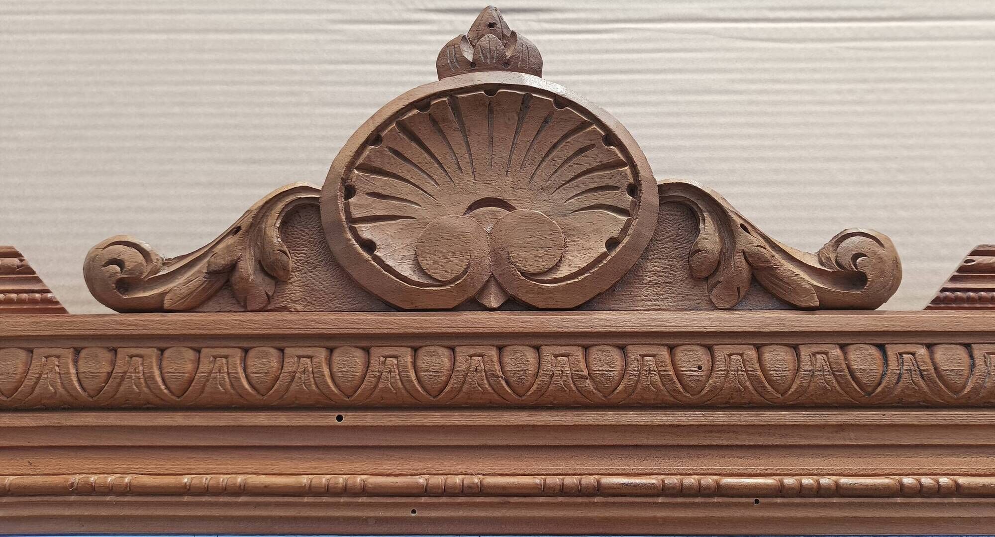 Louis XVI mirror in carved wood, 19th century.