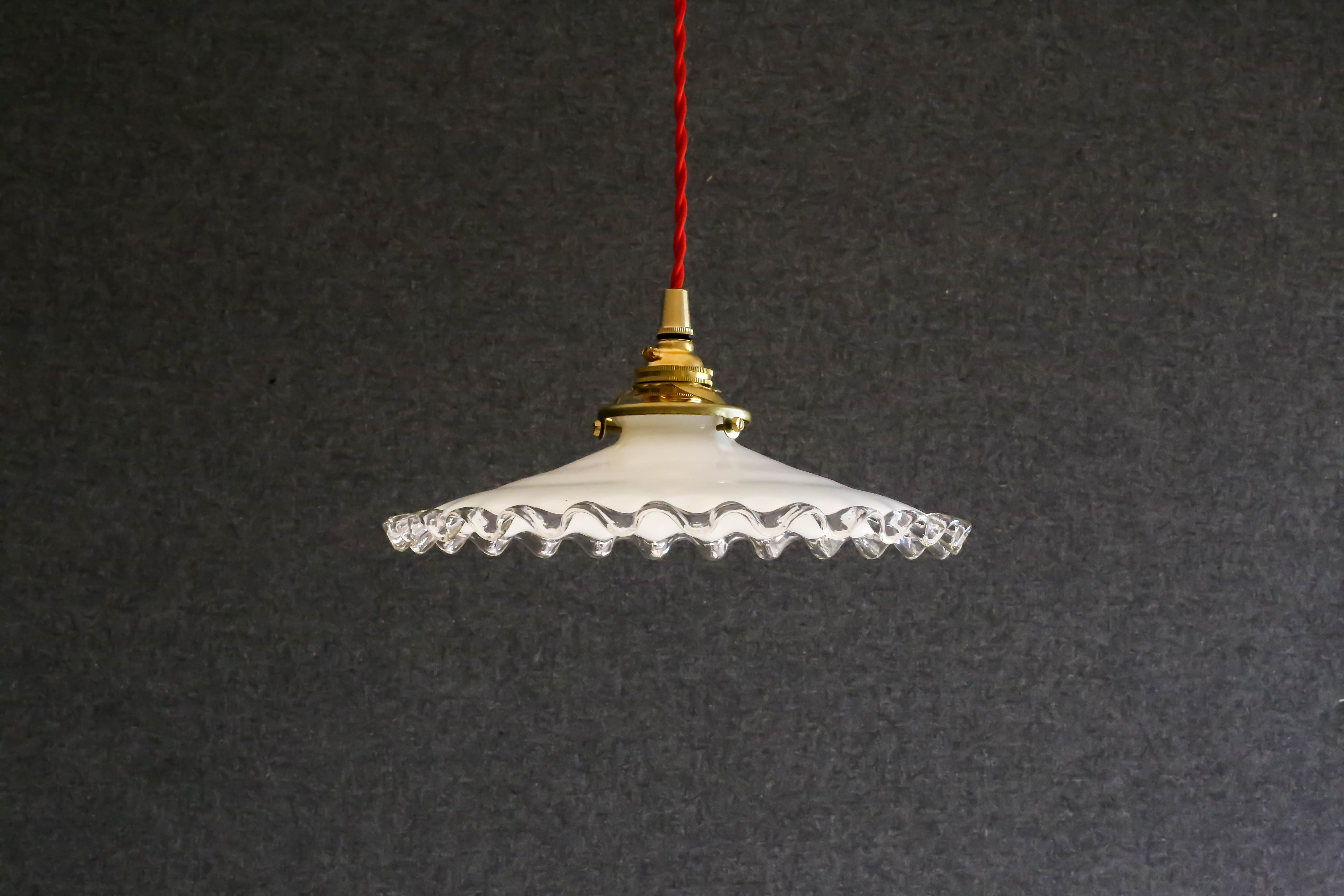 White opaline pendant light with crenellated edges