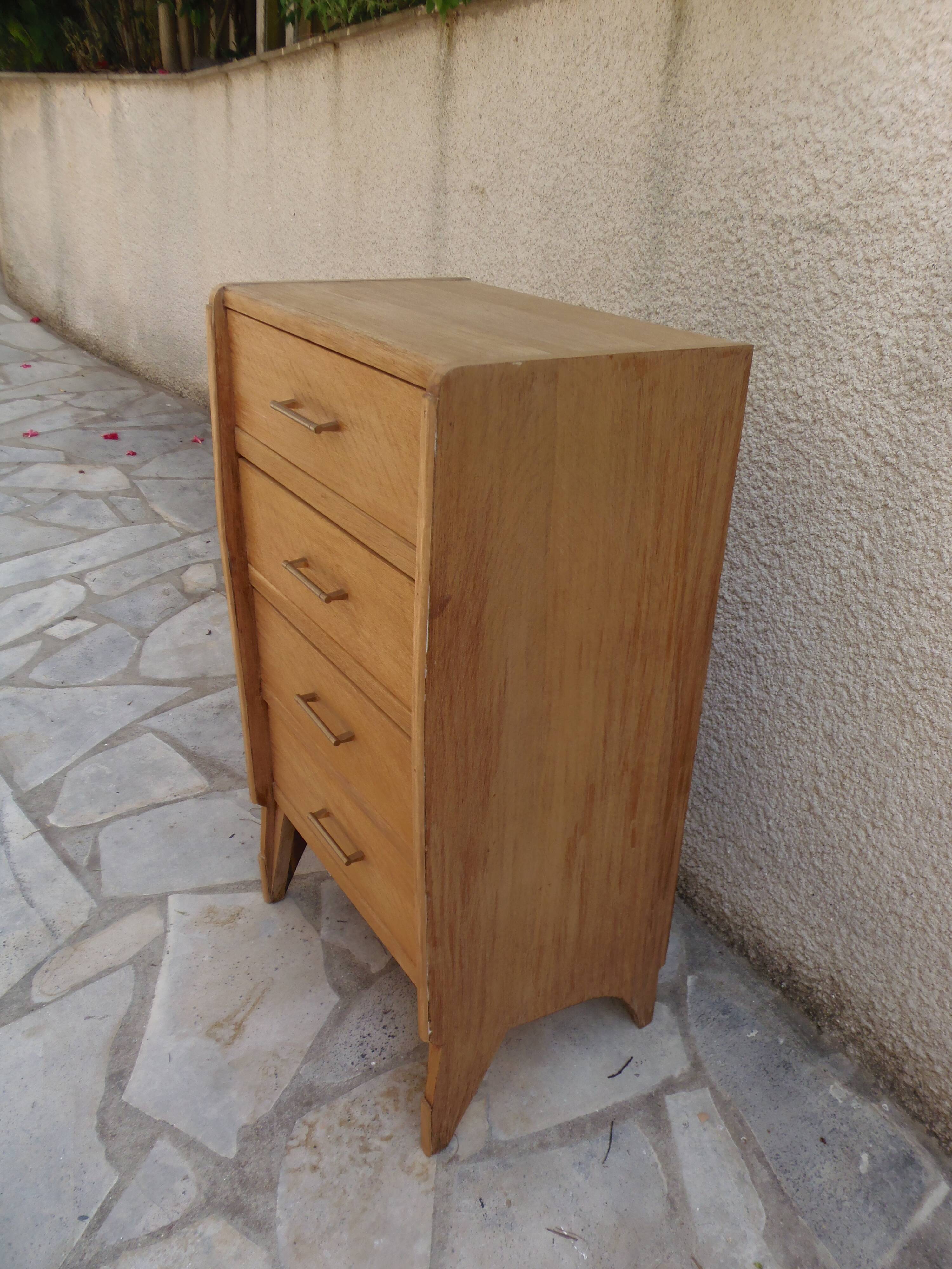 Vintage chest of drawers in raw wood.