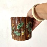 Antique slip pot with acorn decoration