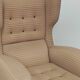 Beige wingback armchair and TVAR footrest, former Czechoslovakia.