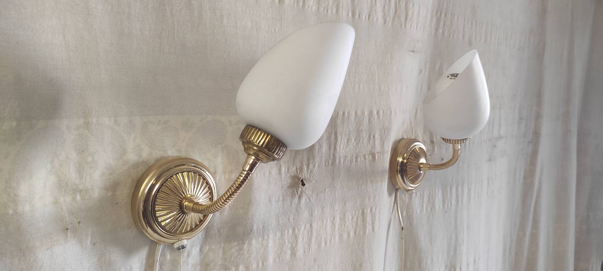 Articulated brass and opaline wall lights - mid 20th century.