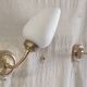 Articulated brass and opaline wall lights - mid 20th century.