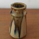 Small ceramic vase with gradients of chestnuts and ochres. Signed.