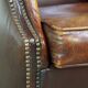 Comfortable, elegant, stately wing chair made of sheepskin in a beautiful warm color