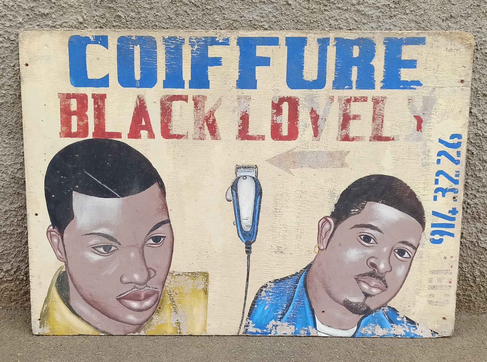 Ancienne enseigne de coiffeur africain