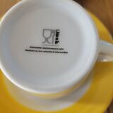 4 yellow and white cups and saucers