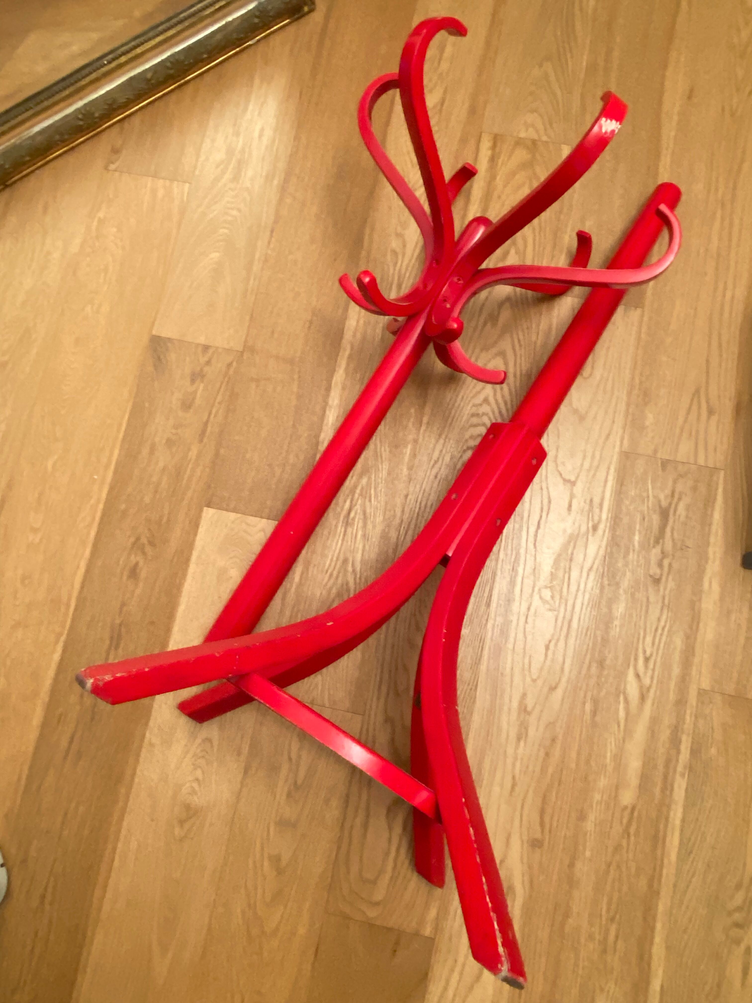 Red Baumann parrot coat rack