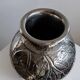 Vintage Italian vase in nickel-plated brass from the 1960s, hand-hammered relief of fruits and leaves.