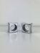 Pair of egg cups or space age napkin rings in aluminium, 1970s.