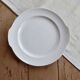 Vintage round white porcelain serving dish with handles.