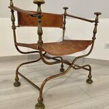 Curule leather armchair