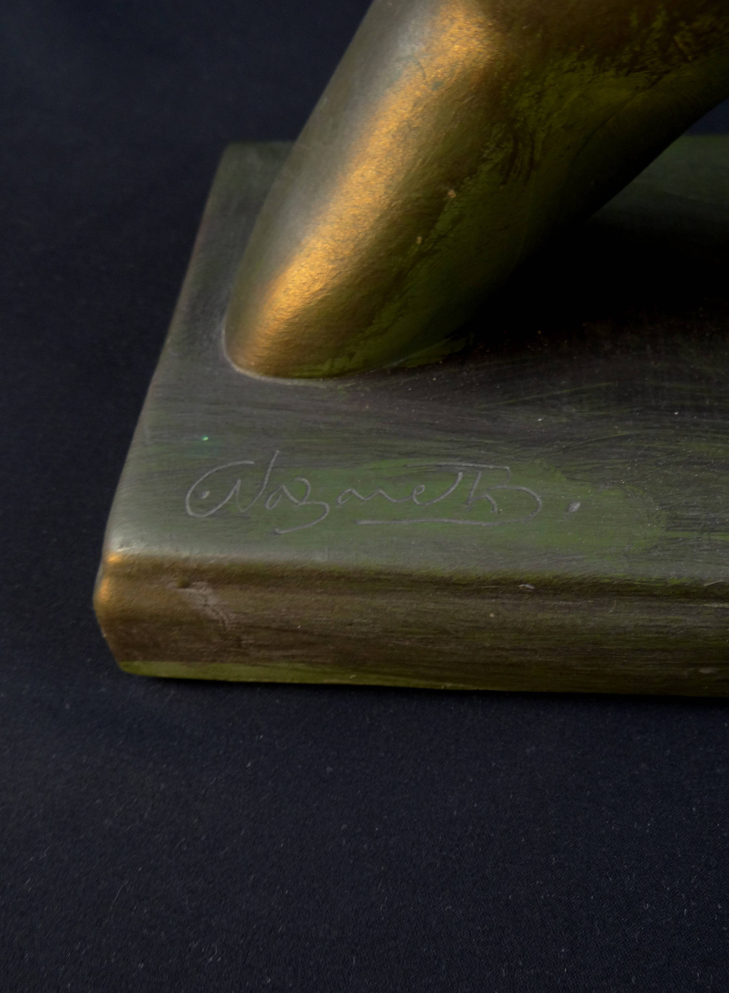 Modern sculpture of a nude woman in green ceramic, signed Carlos Nazareth