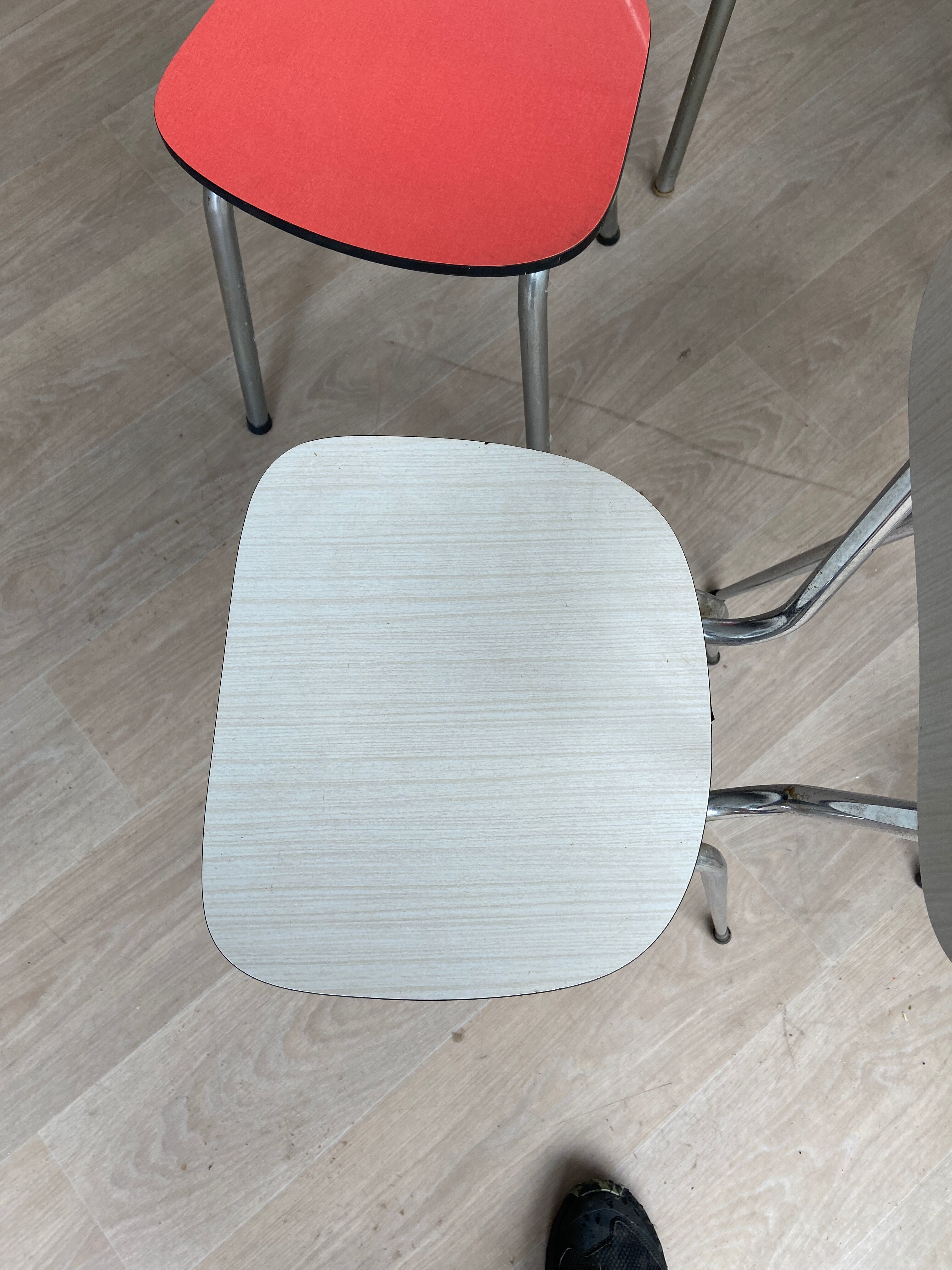 10 mismatched multicolored Formica chairs 60s