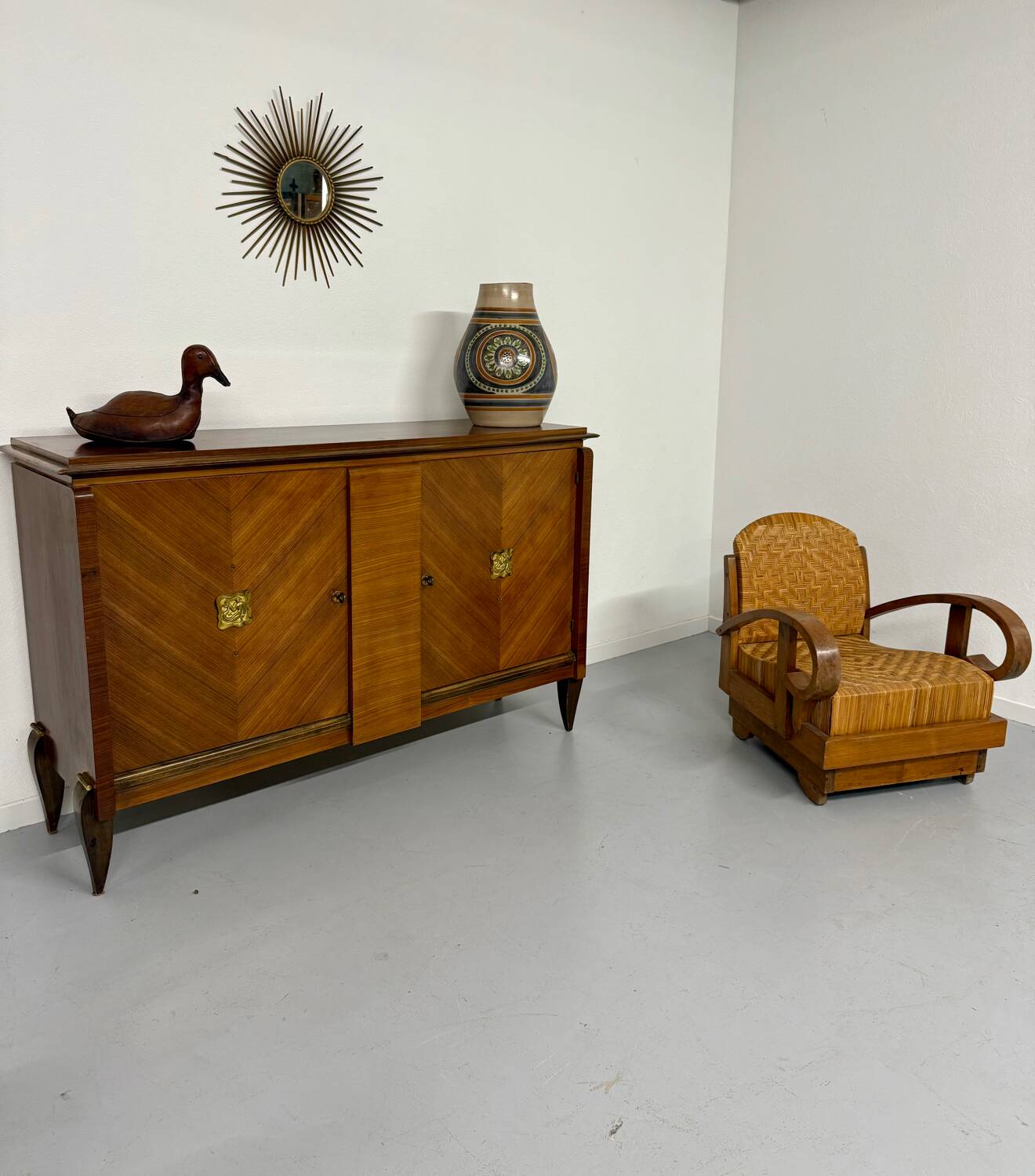 Antique art deco sideboard from the 1930s with veneered wood and bronze insert