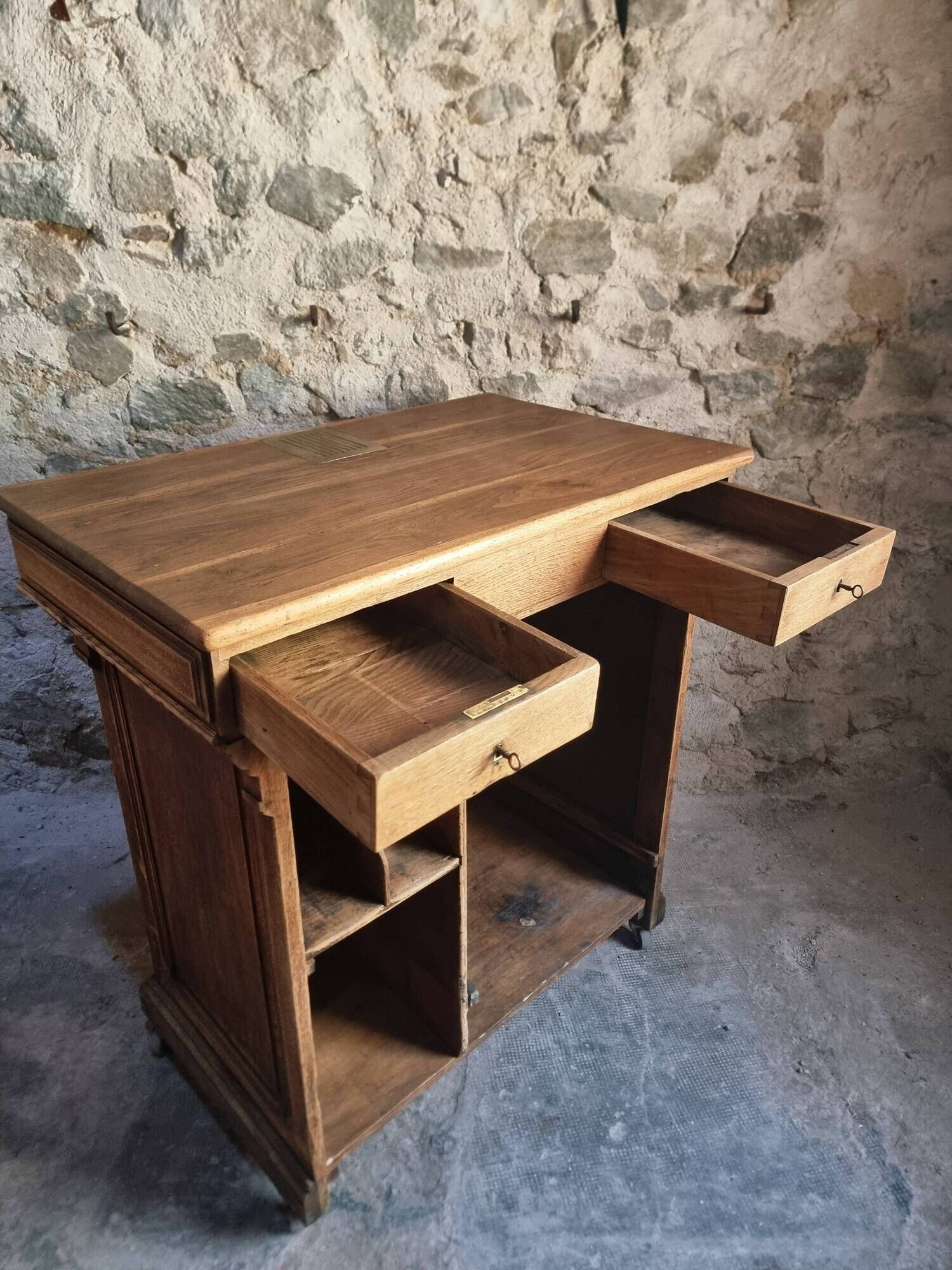 Antique French oak shop counter, kitchen island on wheels, circa 1880–1900.