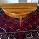 Antique half moon table in walnut