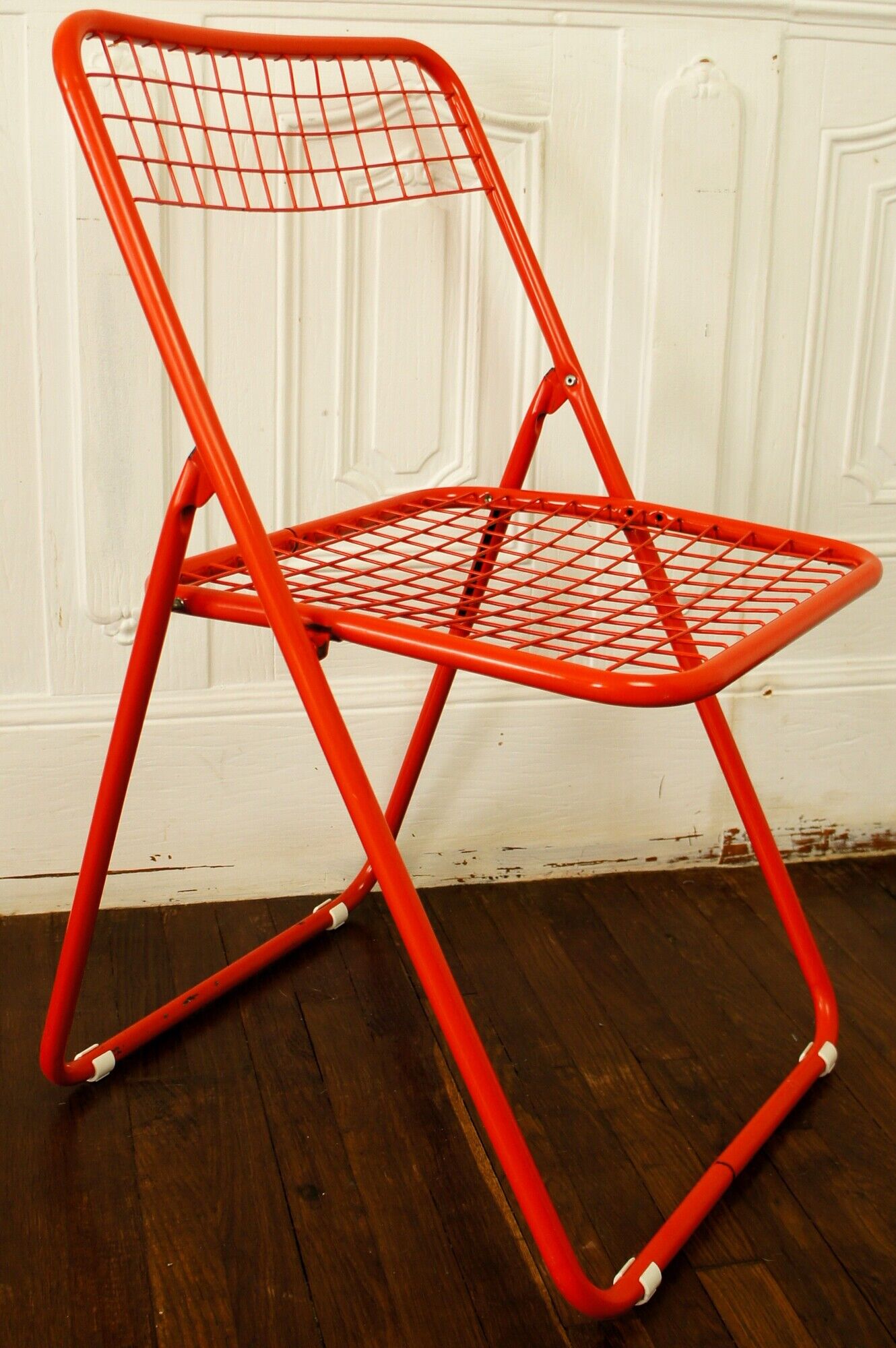 Red "grid" metal folding chair 1980