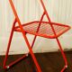 Red "grid" metal folding chair 1980