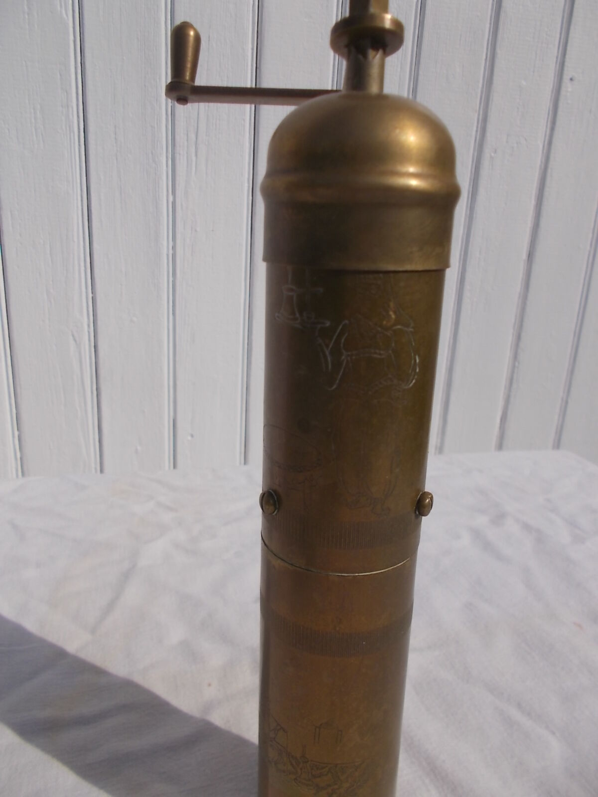Oriental brass pepper mill