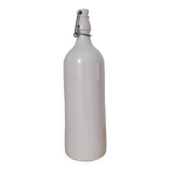M. K. white stoneware bottle M