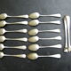 Set of twelve teaspoons and a sugar tongs